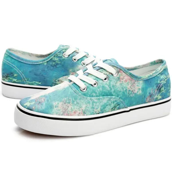 Wholesale China Factory Round Toe Unisex Tie Dye Canvas Shoes for Women—low-top sneakers with white soles and laces, featuring a blue-green marbled pattern accented by pink and purple, perfect for OEM or ODM customization.