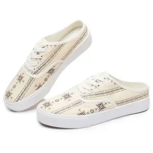 A pair of XRH Wholesale cream canvas slip-on sneakers with white laces, white soles, and a decorative floral and stripe print; customizable with OEM/ODM logo.