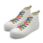 A pair of custom wholesale high-top canvas shoes with rainbow laces and thick soles, classic running rubber flats, available for OEM/ODM customization.