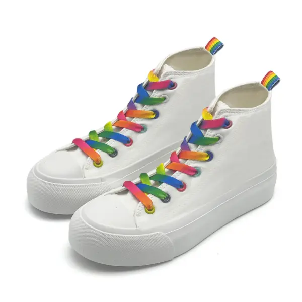 A pair of custom wholesale high-top canvas shoes with rainbow laces and thick soles, classic running rubber flats, available for OEM/ODM customization.