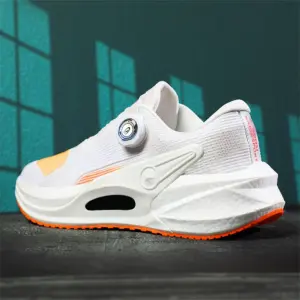 The High Quality Rotating Button Pink Sport Sneakers for men—featuring a circular adjustment dial—are shown against a teal wall, and can be customized for OEM or ODM orders.