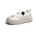 The 2024 OEM ODM PU hollow mesh women's sandal features a white closed-toe, cut-out design, thick beige sole, and black elastic side strap—perfect for summer walking or skateboarding. Customization available.