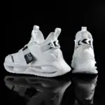 Two modern white wholesale breathable athletic fitness jogging tennis shoes with black accents are displayed front and back against a black background—perfect for showcasing men’s fashion casual walking sport sneakers.