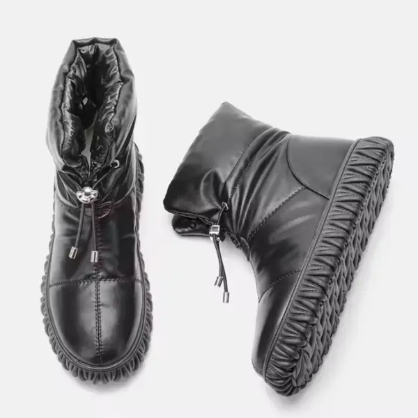 A pair of black Wholesale Customized Plush Thick Genuine Leather Waterproof Bread Cotton Fur Boots for Women snow boots with drawstring closures and textured rubber soles, displayed against a plain white background.