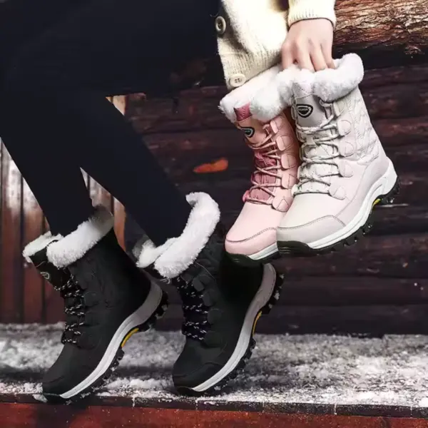 A person sits on snowy wood, wearing black thick-soled cotton women's snow boots and holding pink pairs—perfect for highlighting our customized anti-slip solid color winter laced snow boots with rubber soles, ideal for OEM ODM winter fashion.