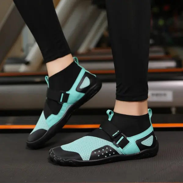 Wearing OEM ODM Outdoor Waterproof Sport EVA Breathable Water Shoes in aqua and black, paired with black leggings, while standing on a treadmill.