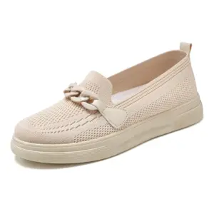 Spring Shoes for Women: beige slip-on with a woven texture, decorative chain on the upper, and flat rubber sole—ideal for OEM/ODM customization.