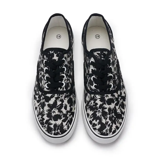 2025 Factory New Style Mixed Trendy Adult Canvas Shoes—rubber flat walking sneakers for women with black and white abstract floral patterns, viewed from above; perfect for OEM or ODM customization.