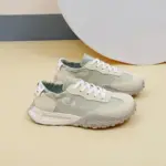 The New Mesh Breathable Sports Sneakers, Summer PU women's rubber lace-up shoes in beige and white, are shown with textured soles on a light surface against a neutral background.