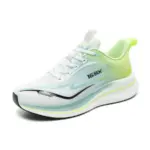 A white men's basketball sneaker with green and black accents, thick cushioned sole, model "16X3 Pro" on the side; available for OEM/ODM customization. High Quality Mesh Soft Sole Sneakers for 2024.