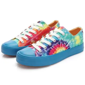 Wholesale sport classic canvas shoes with a blue and yellow tie-dye design, blue rubber soles and toe caps, perfect for school. OEM/ODM customization available.