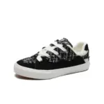 The 2025 Wholesale ODM Custom Summer New Canvas Sneakers feature a black and white tweed pattern, lace-up design, and white rubber sole, shown on a plain background to highlight their OEM/ODM versatility for both women and men.