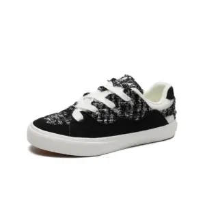 The 2025 Wholesale ODM Custom Summer New Canvas Sneakers feature a black and white tweed pattern, lace-up design, and white rubber sole, shown on a plain background to highlight their OEM/ODM versatility for both women and men.