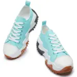 A pair of XRH Wholesale Plain Casual Mujer Ladies Sneakers with custom logo, featuring teal and white canvas uppers and thick brown and black jagged vulcanized rubber soles, displayed on a white background.