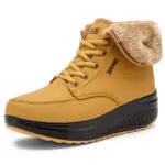 A tan winter waterproof women's snow boot with a fur-lined collar, yellow laces, and thick black sole is shown against a white background, highlighting its Factory Wholesale Custom OEM ODM quality craftsmanship.