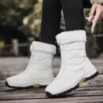 A person wearing Wenzhou Factory 2025 Spring Zipper Women Casual Waterproof Fur Winter Outdoor Snow Boots—ideal for showcasing stylish, versatile OEM ODM women’s footwear.