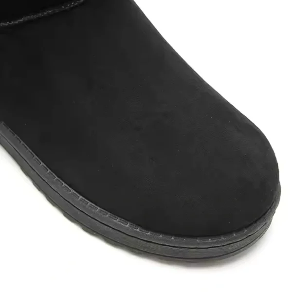 Close-up of the front part of Hot Selling Winter Leather Boots Ankle Shoes Woman, showing black suede with visible stitching on the sole, photographed on a white background—ideal for OEM ODM customization.