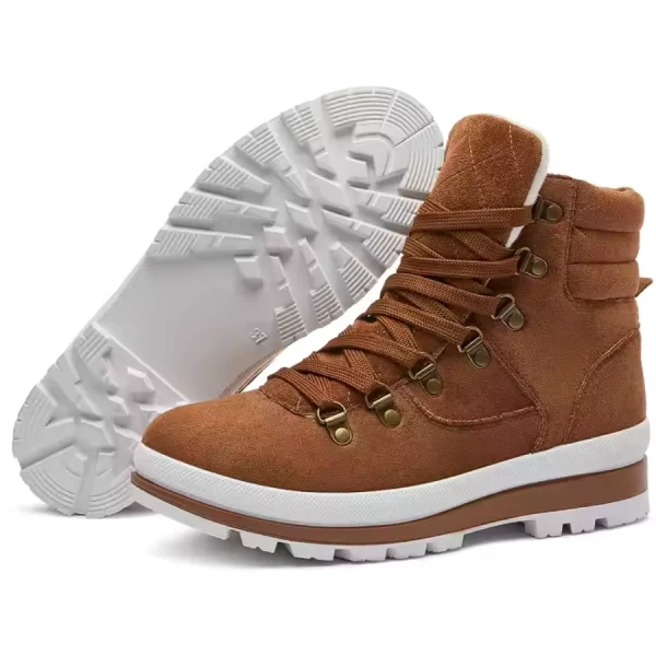 A pair of brown OEM & ODM warm classic high-top women’s snow ankle boots with zippers and white lug soles, one upright and one displaying the tread.