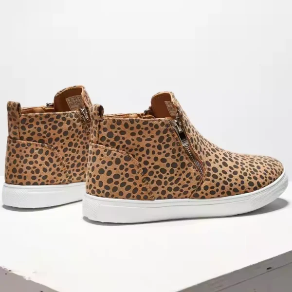 A pair of 2025 New Black Beige Snake Leopard Ankle Boots with white soles and side zippers, perfect for OEM ODM customization—displayed on a white surface, ideal as stylish winter leather boots for women.