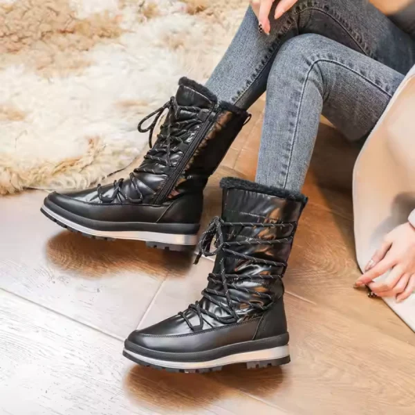 A person wearing Wholesale Fashion Fur Collar Winter Chestnut Snow Boots—thick, non-slip, warm lace-ups—is paired with skinny jeans, seated on a wooden floor beside a furry rug.
